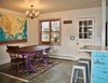 Modern home with Dining Room, Table, Chair, Dark Hardwood Floor, and Ceiling Lighting. The dining area of the great room. Photo 3 of Featherbed Island House. Bayfront Vacation Rental