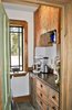 Modern home with Storage Room. The wonderful walk-in pantry with antique, cigar-box cabinets. Photo 4 of Featherbed Island House. Bayfront Vacation Rental