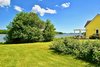 Taken from the rolling lawn Photo 10 of Featherbed Island House. Bayfront Vacation Rental modern home