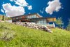 Modern home with Exterior, Metal Roof Material, Stone Siding Material, House Building Type, Wood Siding Material, Metal Siding Material, and Flat RoofLine. Built on just over an acre, no view is obstructed. Photo of Purple Sage