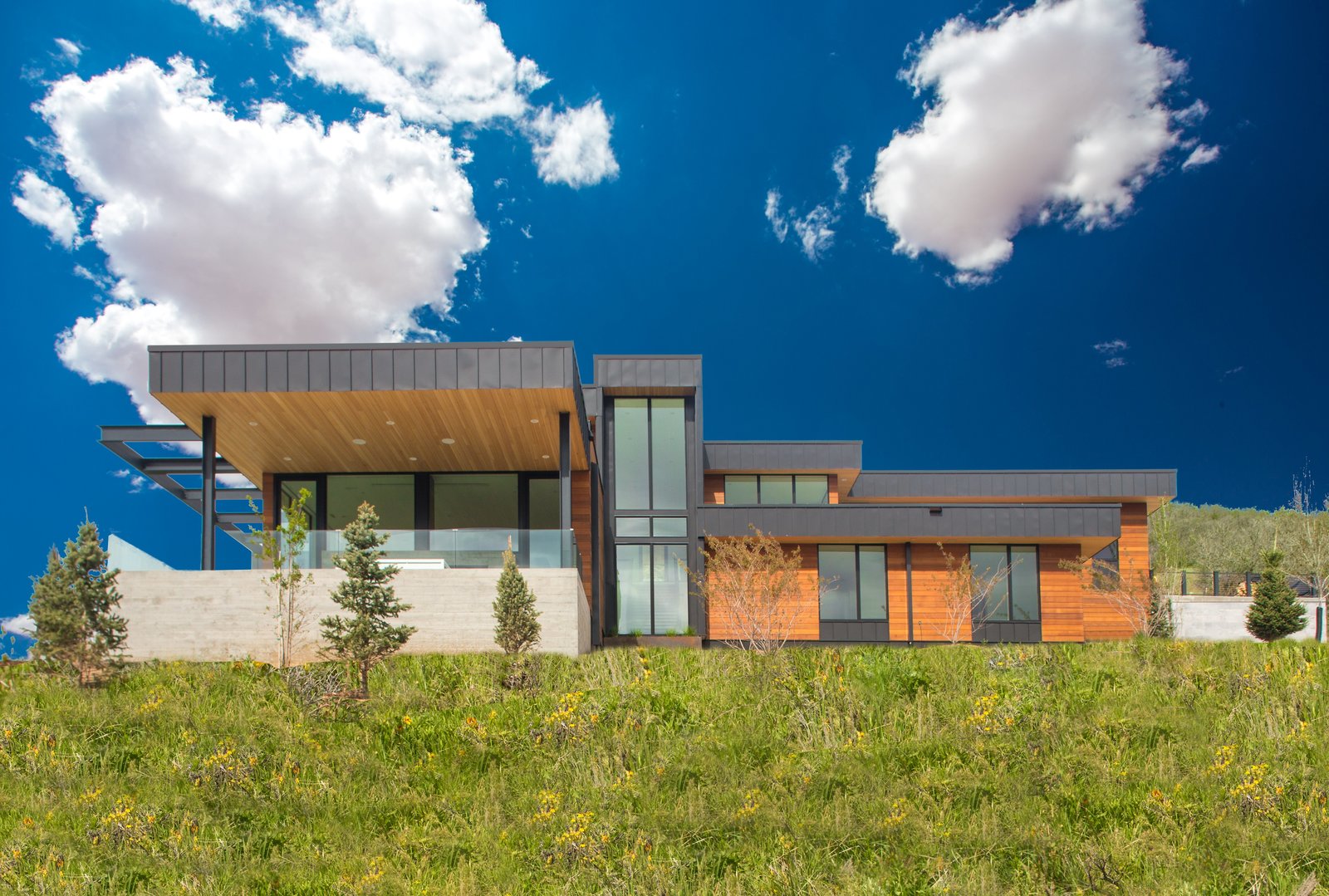 Designed to leave no view unnoticed, this two-story window brings in natural light and showcases the custom-made, metal staircase.