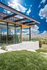 Modern home with Outdoor, Large Patio, Porch, Deck, and Decking Patio, Porch, Deck. A compilation of three exteriors keep the eye moving to appreciate its modern vibe. Photo 11 of Purple Sage