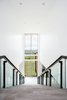 Every step has a view with this two-story window. Photo 12 of Purple Sage modern home
