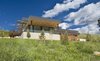 Modern home with Exterior. At this angle, the windows face the valley and golf course. Photo 2 of Purple Sage