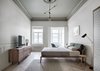 Modern home with Floor Lighting, Chair, Light Hardwood Floor, Pendant Lighting, and Rug Floor. A large, exposed bulb hangs lower than its peers on a three-bulb pendant. The simple design effectively spreads subtle but diffuse light across this elegant, neutral-toned bedroom. Photo 13 of Interior KG