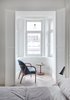 Modern home with Chair, Light Hardwood Floor, and Pendant Lighting. An elegant reading nook lies next to the bed. Photo 15 of Interior KG