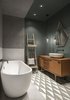 Modern home with Bath Room, Pendant Lighting, Wood Counter, Ceramic Tile Floor, Cement Tile Floor, and Recessed Lighting. In the guest bathroom, a steam room shower portal is finished with marble slabs, while birch plywood clads the dry zone. Photo 17 of Interior KG