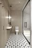 Modern home with Bath Room, Pendant Lighting, Wood Counter, Drop In Sink, Cement Tile Floor, Enclosed Shower, Marble Wall, Two Piece Toilet, Ceramic Tile Floor, Recessed Lighting, and Full Shower. The bathrooms are visually and texturally divided into ceramic granite wet areas and painted dry areas. Photo 6 of Interior KG