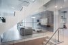 Modern home with Living Room, Sectional, Coffee Tables, Recessed Lighting, and Floor Lighting. Second floor, multi-functional lounge room Photo 3 of Luxe Townhome in Miami's Design District