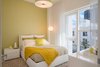 Modern home with Bedroom, Floor Lighting, Bed, Ceiling Lighting, and Night Stands. First Bedroom featuring a vibrant color palette Photo 4 of Luxe Townhome in Miami's Design District