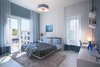 Modern home with Bedroom, Shelves, Ceiling Lighting, Table Lighting, and Bed. Second Bedroom featuring a monochromatic color scheme Photo 5 of Luxe Townhome in Miami's Design District