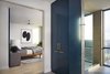 Modern home with Bath Room, Marble Counter, Drop In Sink, Open Shower, and Ceramic Tile Floor. The master bathroom is designed with geometric black and white tile, blue cabinets and brass hardware. Photo 10 of Seaholm Custom Condo