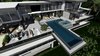 Modern home with Exterior, Stone Siding Material, Flat RoofLine, House Building Type, Brick Siding Material, and Concrete Siding Material. Aerial view of our Magnificent Cantilever Home Photo 3 of Magnificent Cantilever Home For Ocean View Living