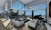 Modern home with Living Room, Track Lighting, Ceiling Lighting, Sofa, Sectional, Light Hardwood Floor, and Medium Hardwood Floor. Living room and pool entrance of our Magnificent Cantilever Home Photo 6 of Magnificent Cantilever Home For Ocean View Living