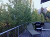 Modern home with Exterior, Wood Siding Material, Metal Roof Material, Apartment Building Type, and Gable RoofLine. Deck with grill Photo 4 of Modern Studio - Pet Friendly