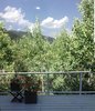 Modern home with Outdoor, Hot Tub Pools, Tubs, Shower, Decking Patio, Porch, Deck, Hanging Lighting, Small Pools, Tubs, Shower, Wood Fences, Wall, and Horizontal Fences, Wall. Deck in summer...like a tree house Photo 5 of Modern Studio - Pet Friendly