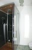 Modern home with Bath Room, Wood Counter, Terrazzo Floor, Corner Shower, One Piece Toilet, Accent Lighting, Ceiling Lighting, Recessed Lighting, and Vessel Sink. Steam shower with radio and chakra lighting Photo 9 of Modern Studio - Pet Friendly