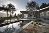 Modern home with Exterior and House. Backyard and outdoor living spaces, looking over the pool to the home and mountain views Photo of Carmel Valley Vistas