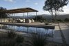 Modern home with Outdoor, Large Patio, Porch, Deck, Grass, Large Pools, Tubs, Shower, Walkways, Hardscapes, Landscape Lighting, Back Yard, and Trees. Looking over the pool to the outdoor living room and mountain views. Photo 2 of Carmel Valley Vistas