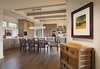 Modern home with Dining Room. The entry way flows gracefully into the open dining room and kitchen spaces. Photo 7 of Carmel Valley Vistas