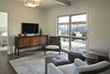 Modern home with Bedroom. The master suite features a sitting room, bedroom and spacious master bath, all with mountain views. Photo 9 of Carmel Valley Vistas