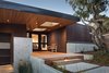 Modern home with Exterior. Rich wood provides a warm welcome to this contemporary home. Photo of Rustic Meets Modern