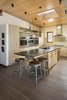 Modern home with Kitchen. Air-sealing and thorough insulation create energy efficiency in Studio Zerbey Architecture's Rustic Meets Modern house. Additionally, much of the framing wood is Forest Stewardship Council certified. Photo 7 of Rustic Meets Modern