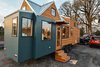 Modern home with Exterior, Metal Roof Material, Gable RoofLine, Cabin Building Type, House Building Type, Prefab Building Type, and Wood Siding Material. Paneling and Tight Knot Cedar siding. Galvalume Roofing and removable awning. Photo 3 of Not So tiny Tiny, for a Doctor in California