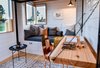 Modern home with Office, Study Room Type, Storage, Desk, Light Hardwood Floor, and Chair. Cedar Slab Desk Doubles as the Headboard. Photo 9 of Not So tiny Tiny, for a Doctor in California