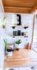 Modern home with Kitchen, Light Hardwood Floor, Drop In Sink, Wood Counter, White Cabinet, Wall Lighting, and Accent Lighting. Maintaining an open feel in the kitchen by using open shelves. Photo 15 of Not So tiny Tiny, for a Doctor in California