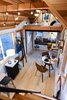 Modern home with Dining Room, Ceiling Lighting, Light Hardwood Floor, Chair, and Table. Bamboo floors and cedar ceiling. Photo 18 of Not So tiny Tiny, for a Doctor in California