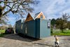 Modern home with Exterior, Wood Siding Material, Prefab Building Type, Metal Roof Material, and Gable RoofLine. Paneling exterior with Tight Knot cedar detailing. Photo 20 of Not So tiny Tiny, for a Doctor in California