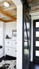 Modern home with Office, Craft Room Room Type, Study Room Type, Storage, and Dark Hardwood Floor. Office with Barn Door. Tru Form Tiny Photo 2 of Full Solar Tiny Home & Open Layout