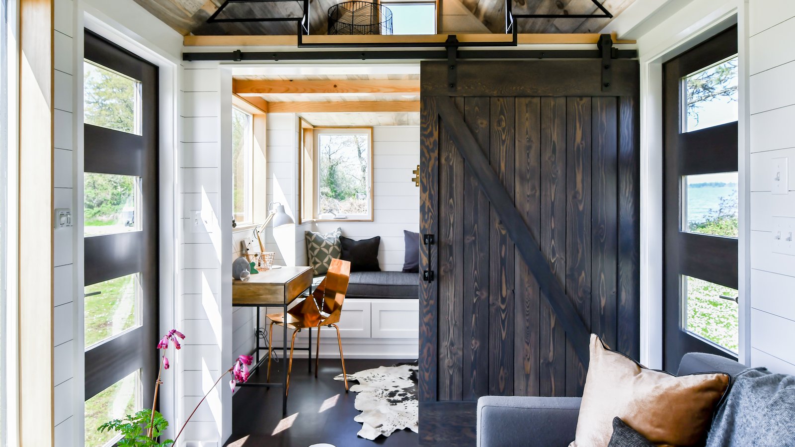 Beautiful tiny home with lots of windows letting in plenty of light