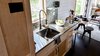Modern home with Dark Hardwood Floor. Kitchen DS. Tru Form Tiny Photo 20 of Full Solar Tiny Home & Open Layout