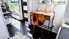 Modern home with Office, Dark Hardwood Floor, Study Room Type, Desk, and Storage. Office with Barn Door. Tru Form Tiny Photo 6 of Full Solar Tiny Home & Open Layout