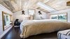 Modern home with Bedroom, Wall Lighting, Dark Hardwood Floor, and Bed. Loft with Skylight. Tru Form Tiny Photo 8 of Full Solar Tiny Home & Open Layout