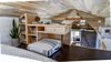 Modern home with Bedroom, Ceiling Lighting, Shelves, Dresser, and Dark Hardwood Floor. Built in loft desk. Tru Form Tiny Loft. Photo 9 of Full Solar Tiny Home & Open Layout
