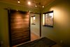 Modern home with Light Hardwood Floor. custom barn door built of reclaimed local wood Photo 16 of SkyNest