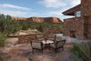 Modern home with Outdoor, Small Patio, Porch, Deck, Front Yard, Side Yard, Desert, Stone Patio, Porch, Deck, Flowers, Hanging Lighting, Hardscapes, Landscape Lighting, and Raised Planters. Sunset Patio With Fireplace Photo 3 of Sedona. Extraordinary. Serenity. Luxury. Green Living.
