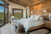 Modern home with Bedroom, Wall Lighting, Travertine Floor, Ceiling Lighting, Bed, Night Stands, Chair, Storage, Accent Lighting, Track Lighting, Dresser, Pendant Lighting, and Recessed Lighting. Awaken To Incredible Views From Master Suite and Yoga Meditation Room Photo 10 of Sedona. Extraordinary. Serenity. Luxury. Green Living.