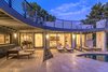 Modern home with House Building Type, Stone Siding Material, Stucco Siding Material, and Flat RoofLine. Back Patio Feature 2nd Story Sky-Deck Photo 2 of The Allen House