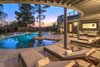 Modern home with Outdoor, Large Patio, Porch, Deck, Metal Fences, Wall, Shrubs, Landscape Lighting, Back Yard, Grass, Trees, Swimming Pools, Tubs, Shower, Concrete Patio, Porch, Deck, and Large Pools, Tubs, Shower. Pool Patio At Sunset Photo 10 of The Allen House