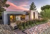 Modern home with Exterior, House Building Type, Stone Siding Material, Stucco Siding Material, and Flat RoofLine. Front Patio Offers An Additional Space For Entertaining Surrounded By Lush Desert Landscaping Photo 15 of The Allen House