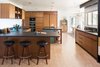 Modern home with Kitchen, Wood Cabinet, Granite Counter, Dishwasher, Undermount Sink, Microwave, Refrigerator, Wall Oven, Cork Floor, Stone Slab Backsplashe, Recessed Lighting, Colorful Cabinet, Ceiling Lighting, and Cooktops. Kitchen Photo 7 of Glendale Mid Century