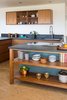Modern home with Kitchen, Ceiling Lighting, Granite Counter, Colorful Cabinet, Cork Floor, Wood Cabinet, Undermount Sink, Stone Slab Backsplashe, and Cooktops. Kitchen Photo 8 of Glendale Mid Century
