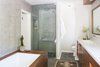 Modern home with Bath Room, Stone Tile Wall, Engineered Quartz Counter, Ceiling Lighting, Open Shower, Undermount Sink, Undermount Tub, Slate Floor, and Two Piece Toilet. Master Bathroom Photo 13 of Glendale Mid Century