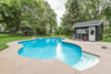Modern home with Outdoor, Large Pools, Tubs, Shower, and Back Yard. Large custom pool with concrete deck, pool house and river rock gardens. There is a large barn and shed in the background outside the pool enclosure. Photo 3 of The Empress