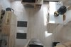 Modern home with Kitchen, Ceiling Lighting, Wood Cabinet, Light Hardwood Floor, Wood Counter, Undermount Sink, Drop In Sink, Refrigerator, Wall Oven, and Cooktops. Kitchen and dining Photo 8 of The Litwood House