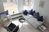 Modern home with Living Room, Coffee Tables, Chair, Wall Lighting, and Light Hardwood Floor. Couch Photo 9 of The Litwood House